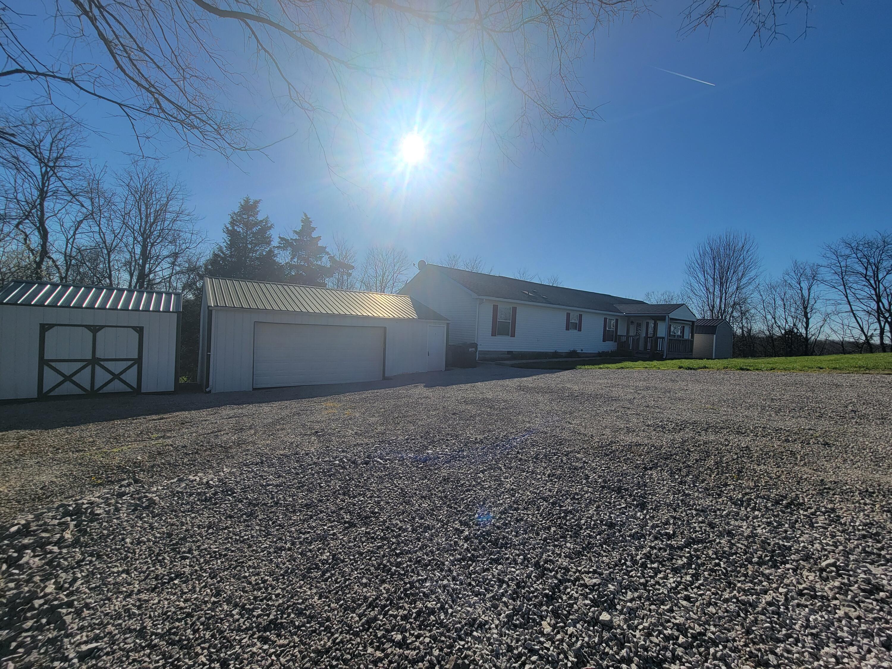 278 Luke Road Sadieville, KY 40370 - Photo 23 of 47 Tons of parking, large driveway space, 2 car detached garage, additional shed for tools, toys, and the like.