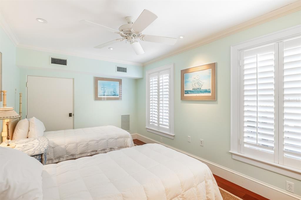 2571 Shore Lane Boca Grande, FL 33921 - Photo 19 of 38 a bedroom with a large bed and a window