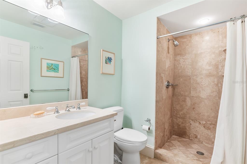 2571 Shore Lane Boca Grande, FL 33921 - Photo 21 of 38 a bathroom with a sink toilet and shower