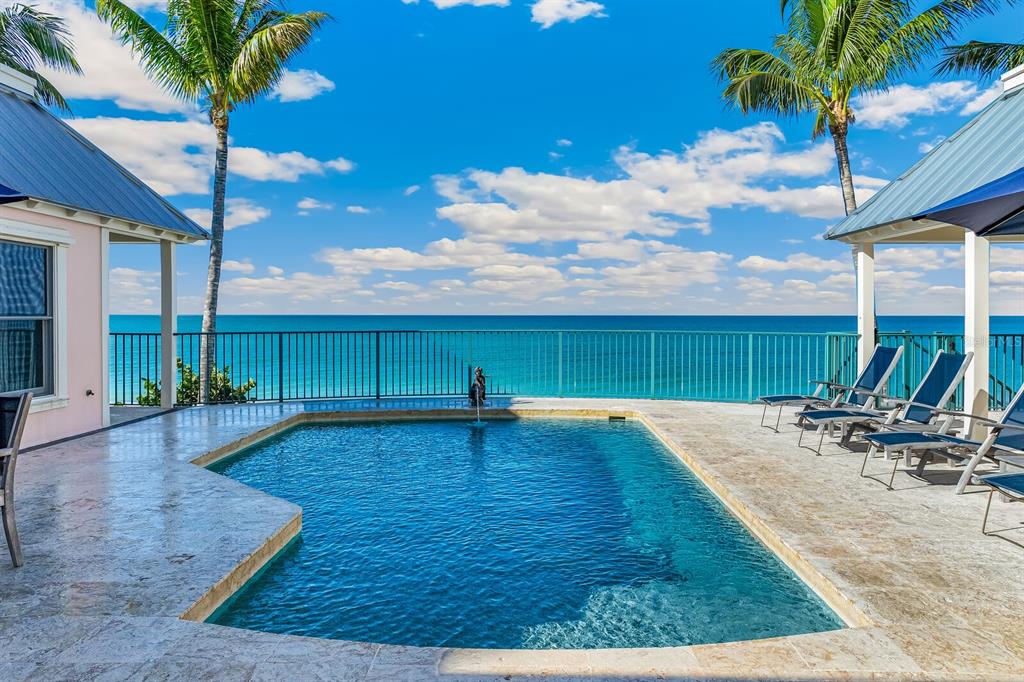 2571 Shore Lane Boca Grande, FL 33921 - Photo 25 of 38 a swimming pool with outdoor seating