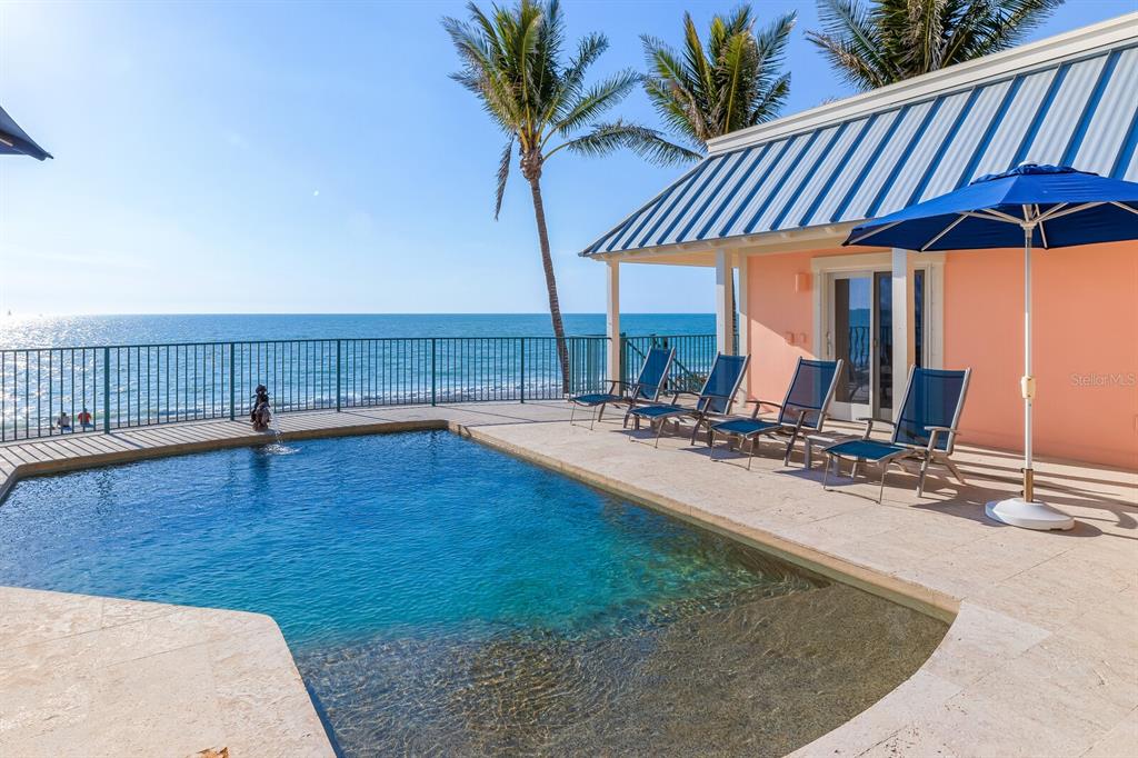 2571 Shore Lane Boca Grande, FL 33921 - Photo 26 of 38 a view of a swimming pool with a patio