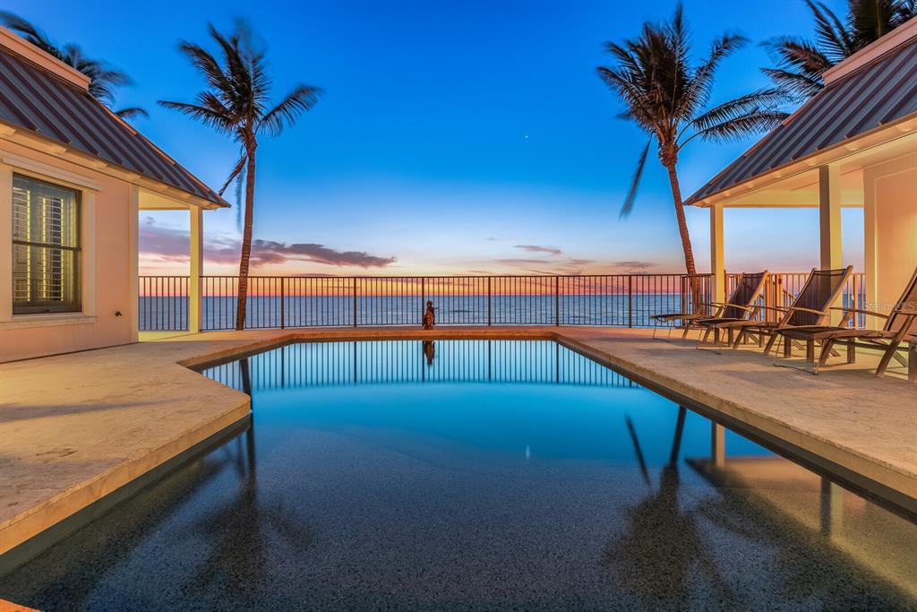 2571 Shore Lane Boca Grande, FL 33921 - Photo 27 of 38 a view of a swimming pool with a lounge chair