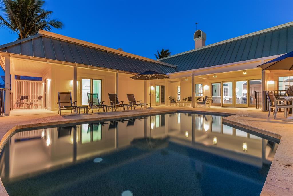 2571 Shore Lane Boca Grande, FL 33921 - Photo 30 of 38 a view of a swimming pool with a patio