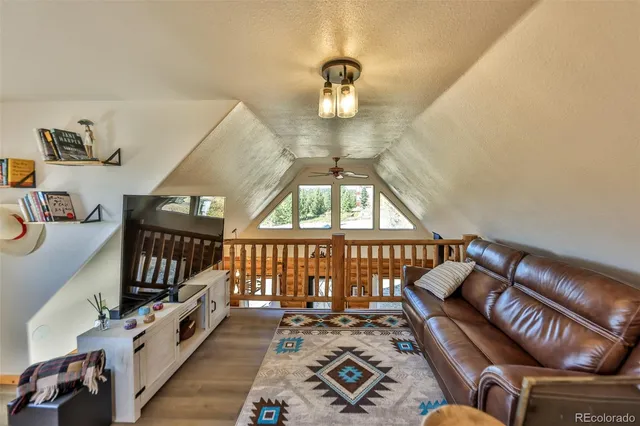 a view of balcony with wooden floor
