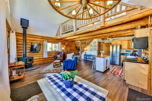 a living room with furniture and wooden floors