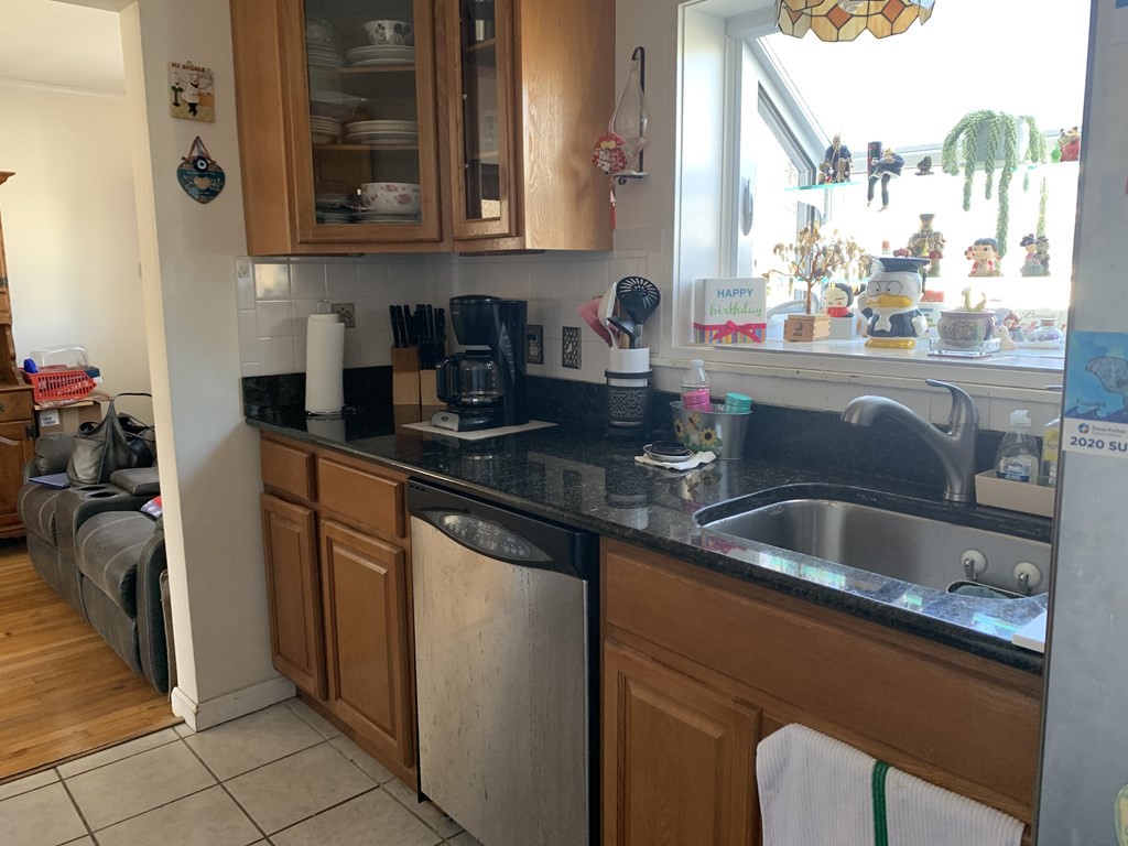 3 Aberdeen Road Quincy, MA 02171 - Photo 3 of 9 a kitchen with a sink and cabinets
