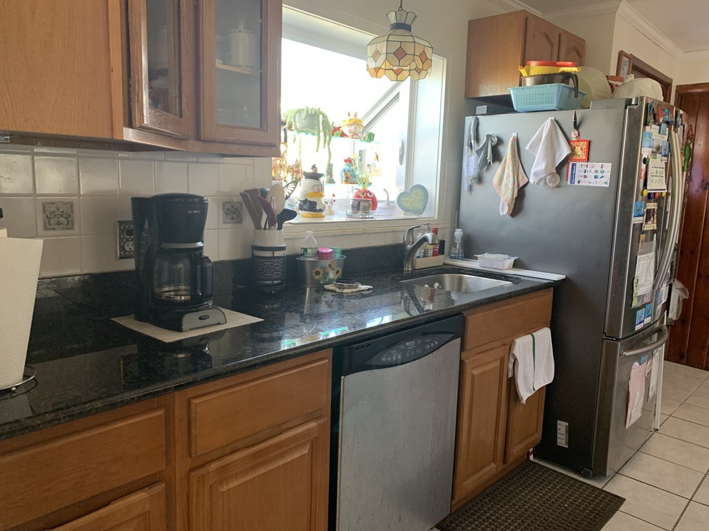 3 Aberdeen Road Quincy, MA 02171 - Photo 4 of 9 a kitchen with stainless steel appliances granite countertop a sink stove and refrigerator