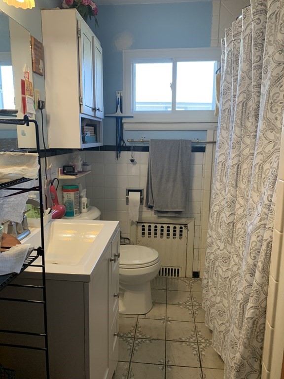 3 Aberdeen Road Quincy, MA 02171 - Photo 8 of 9 a bathroom with a sink a toilet and a window