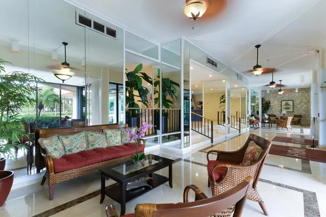 a view of a dining room with furniture wooden floor and chandelier
