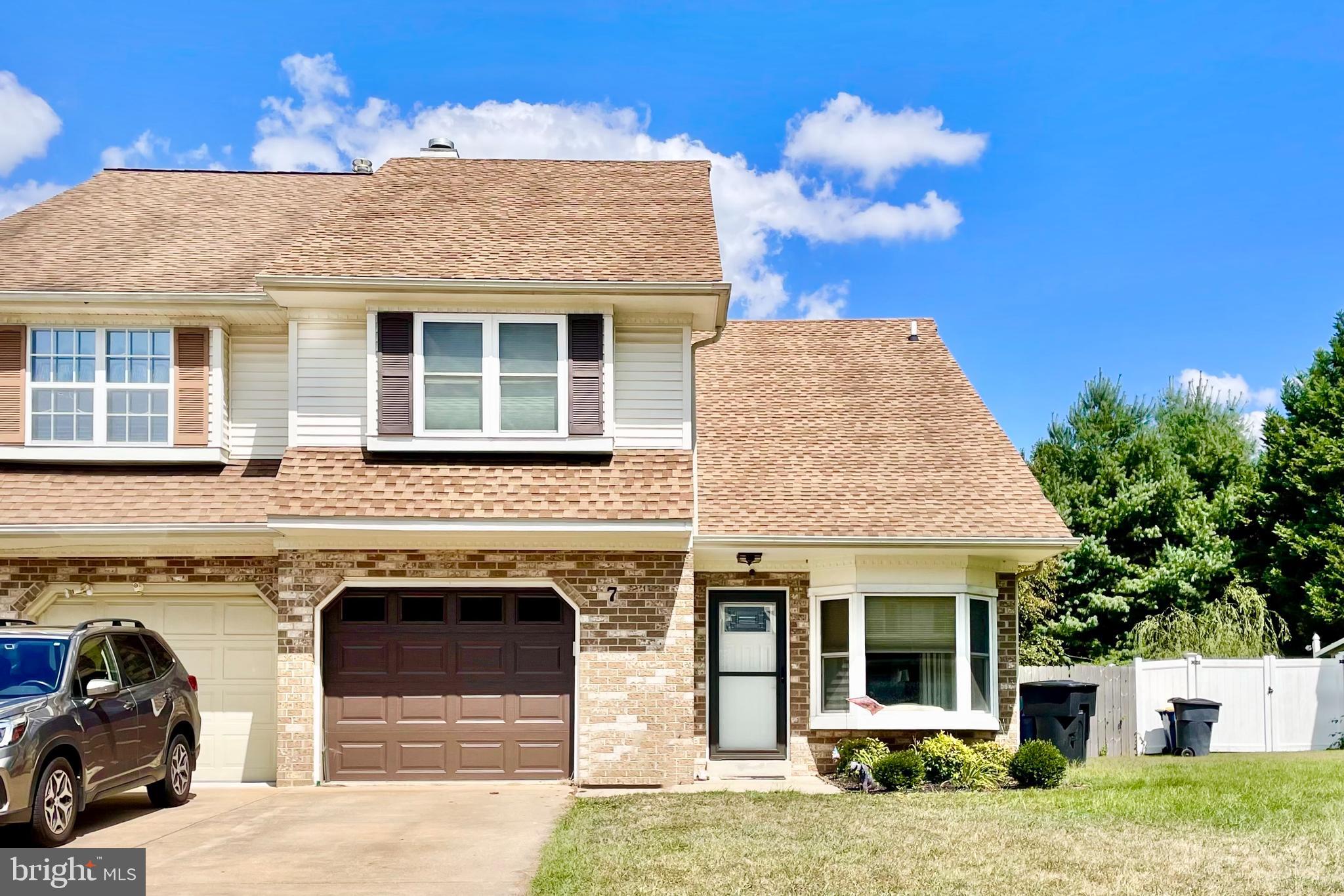 7 Gristmill Drive Dover, DE 19904 - Photo 1 of 26 a front view of a house with a garden