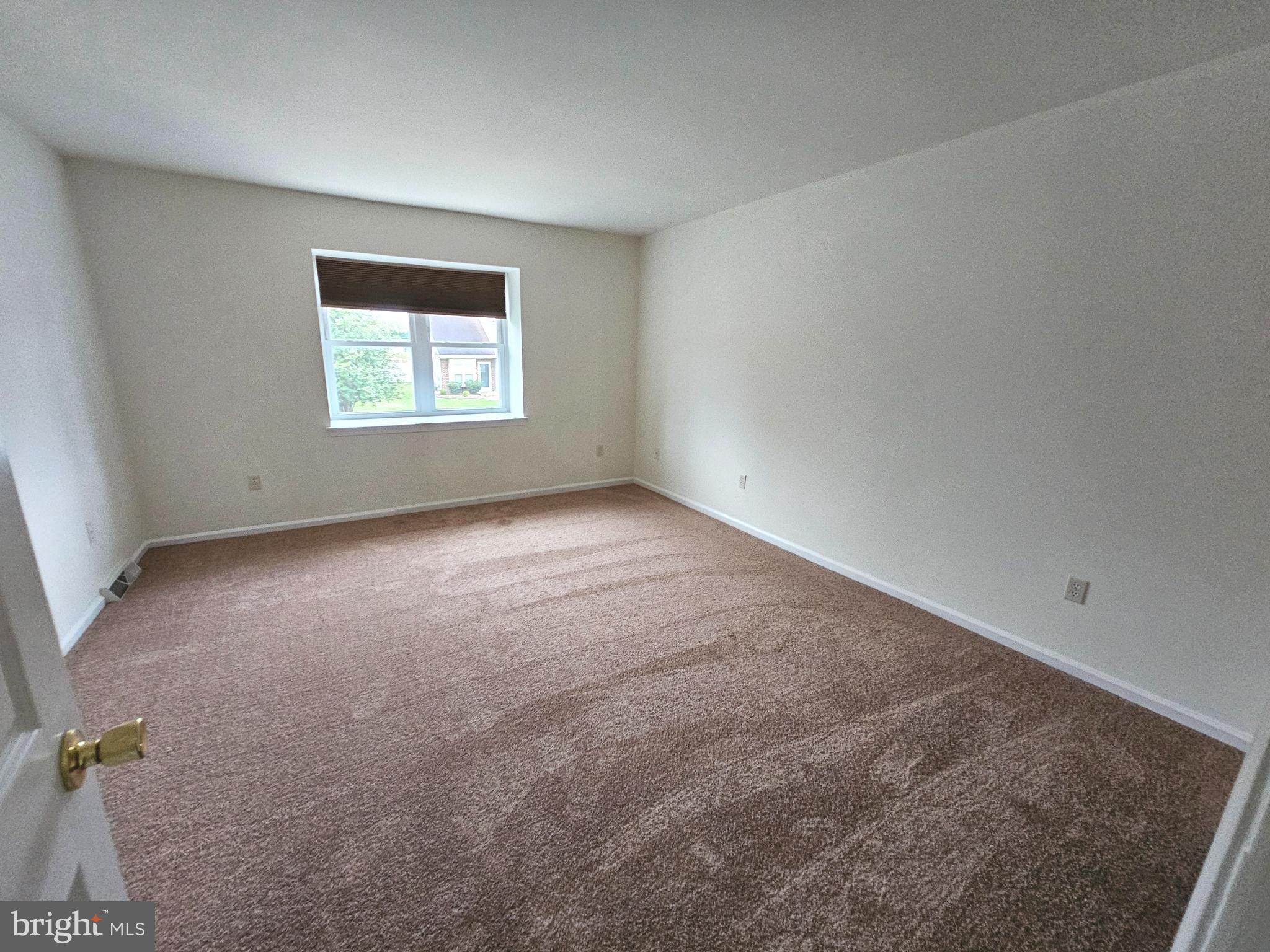 7 Gristmill Drive Dover, DE 19904 - Photo 12 of 26 an empty room with a window