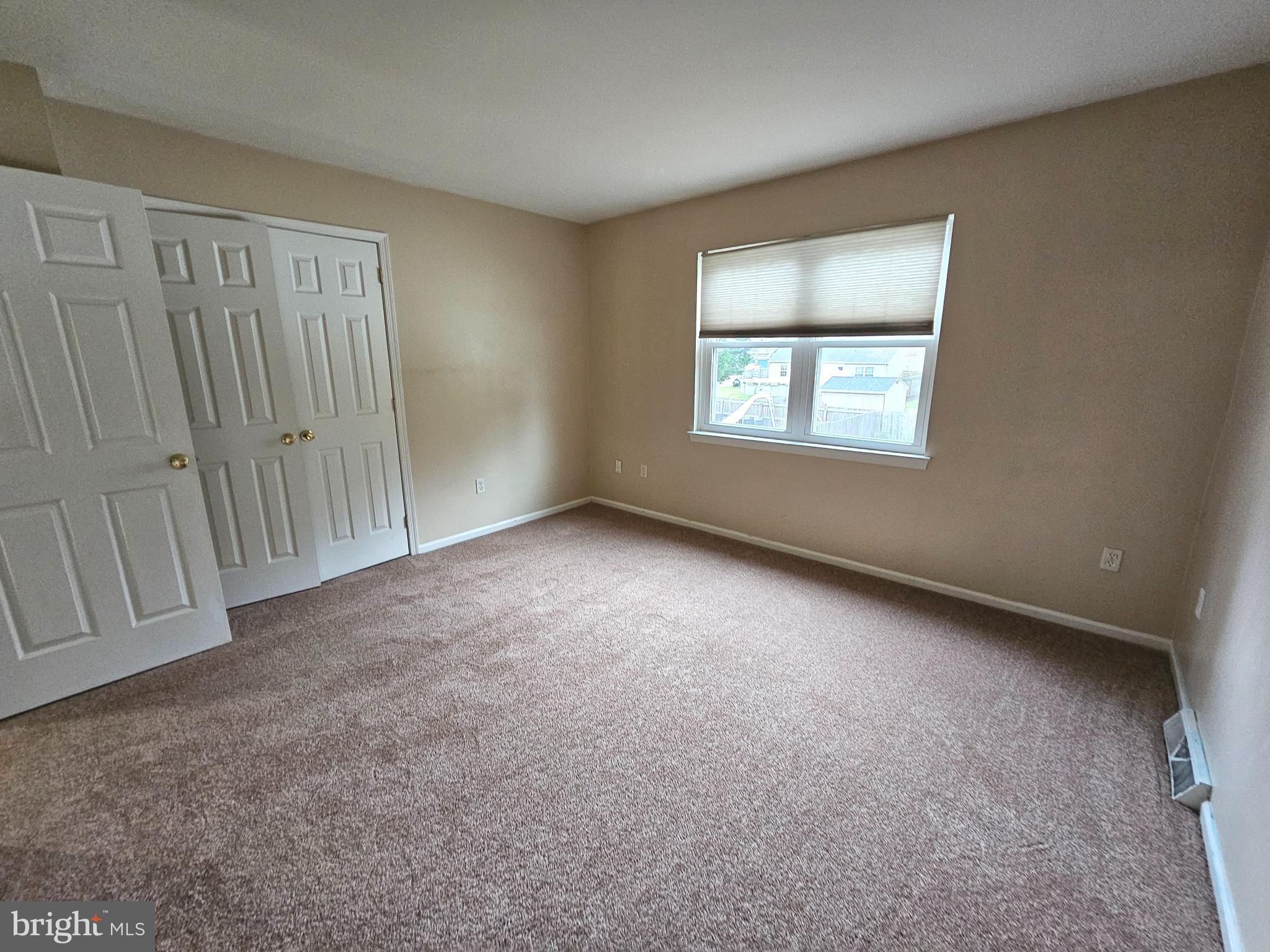 7 Gristmill Drive Dover, DE 19904 - Photo 18 of 26 an empty room with a empty space and windows