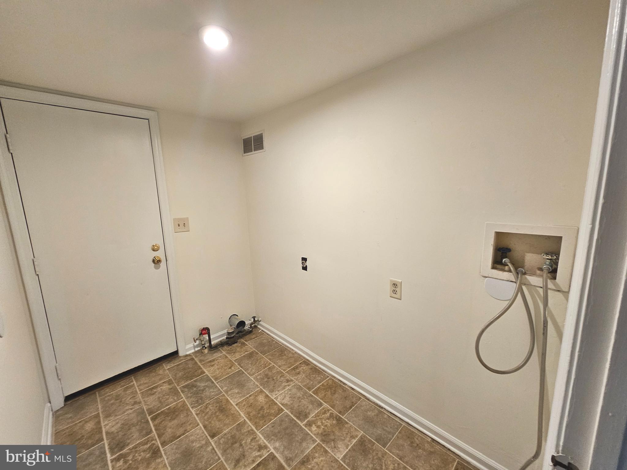 7 Gristmill Drive Dover, DE 19904 - Photo 23 of 26 a view of a room with rack on the wall