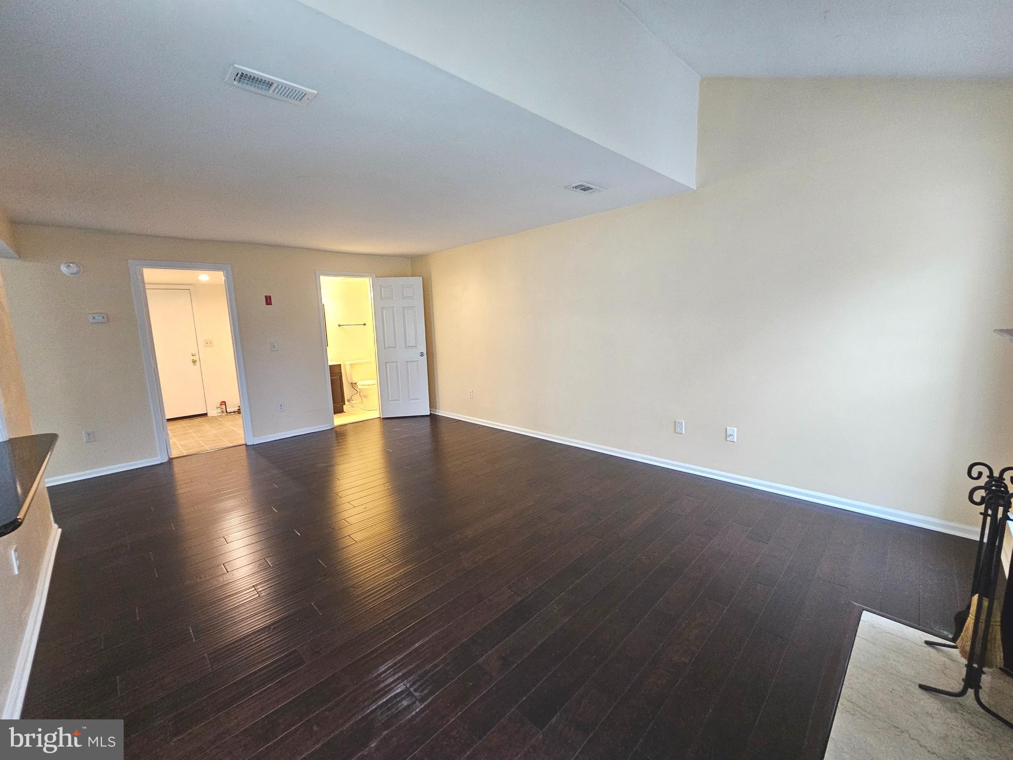 7 Gristmill Drive Dover, DE 19904 - Photo 5 of 26 an empty room with wooden floor and windows
