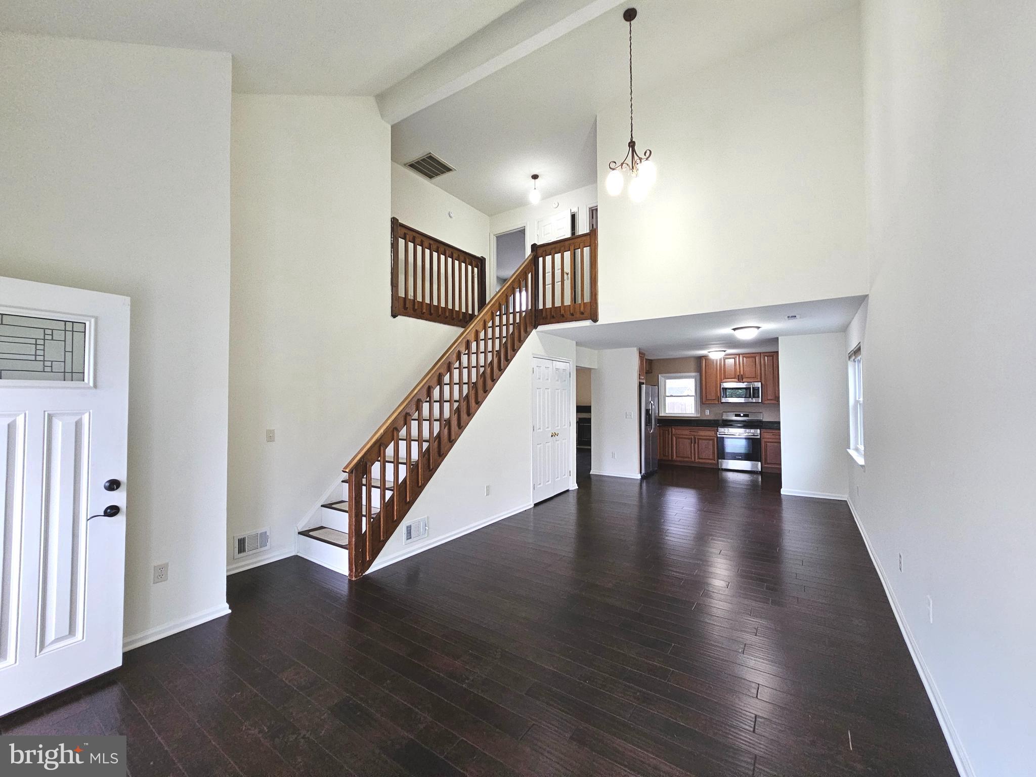 7 Gristmill Drive Dover, DE 19904 - Photo 6 of 26 a view of an entryway with wooden floor