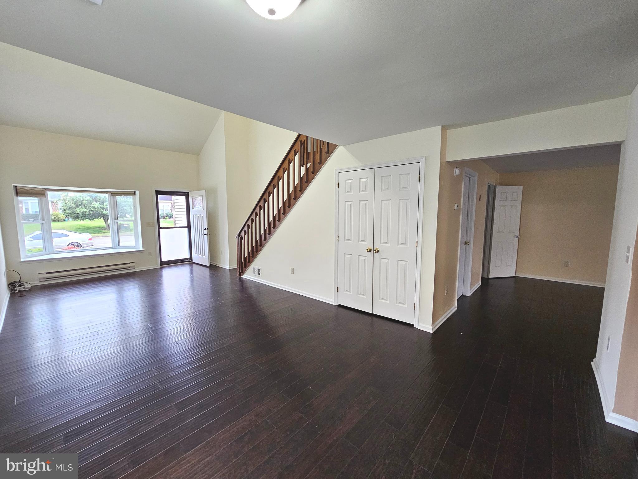 7 Gristmill Drive Dover, DE 19904 - Photo 7 of 26 a view of an empty room with wooden floor and a window