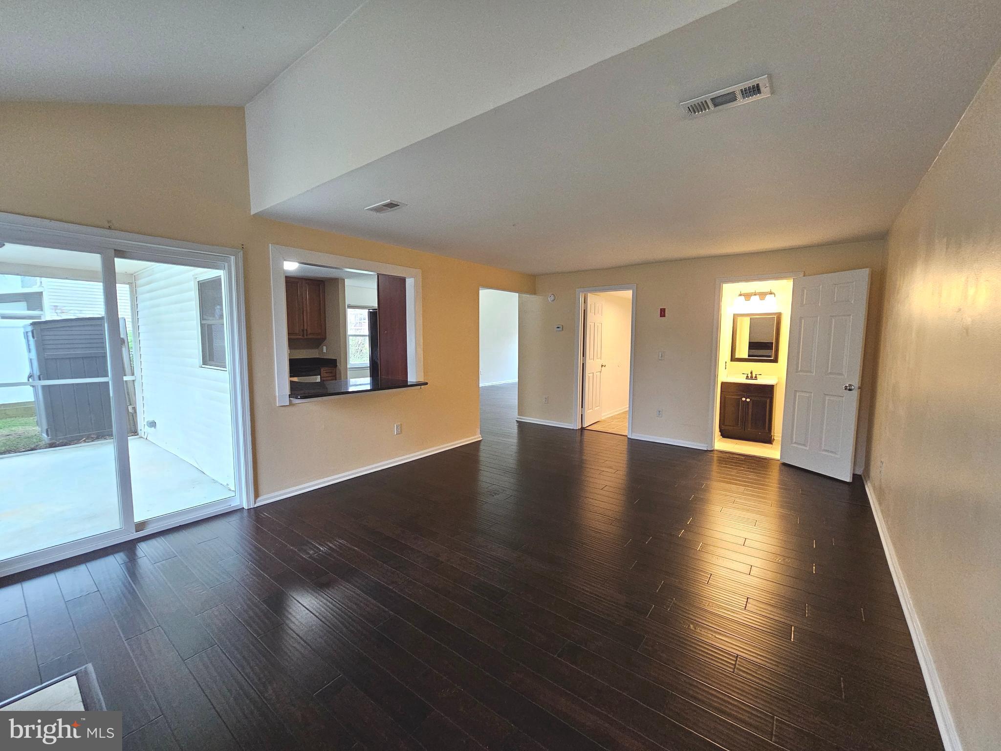 7 Gristmill Drive Dover, DE 19904 - Photo 9 of 26 a view of an empty room with window and wooden floor