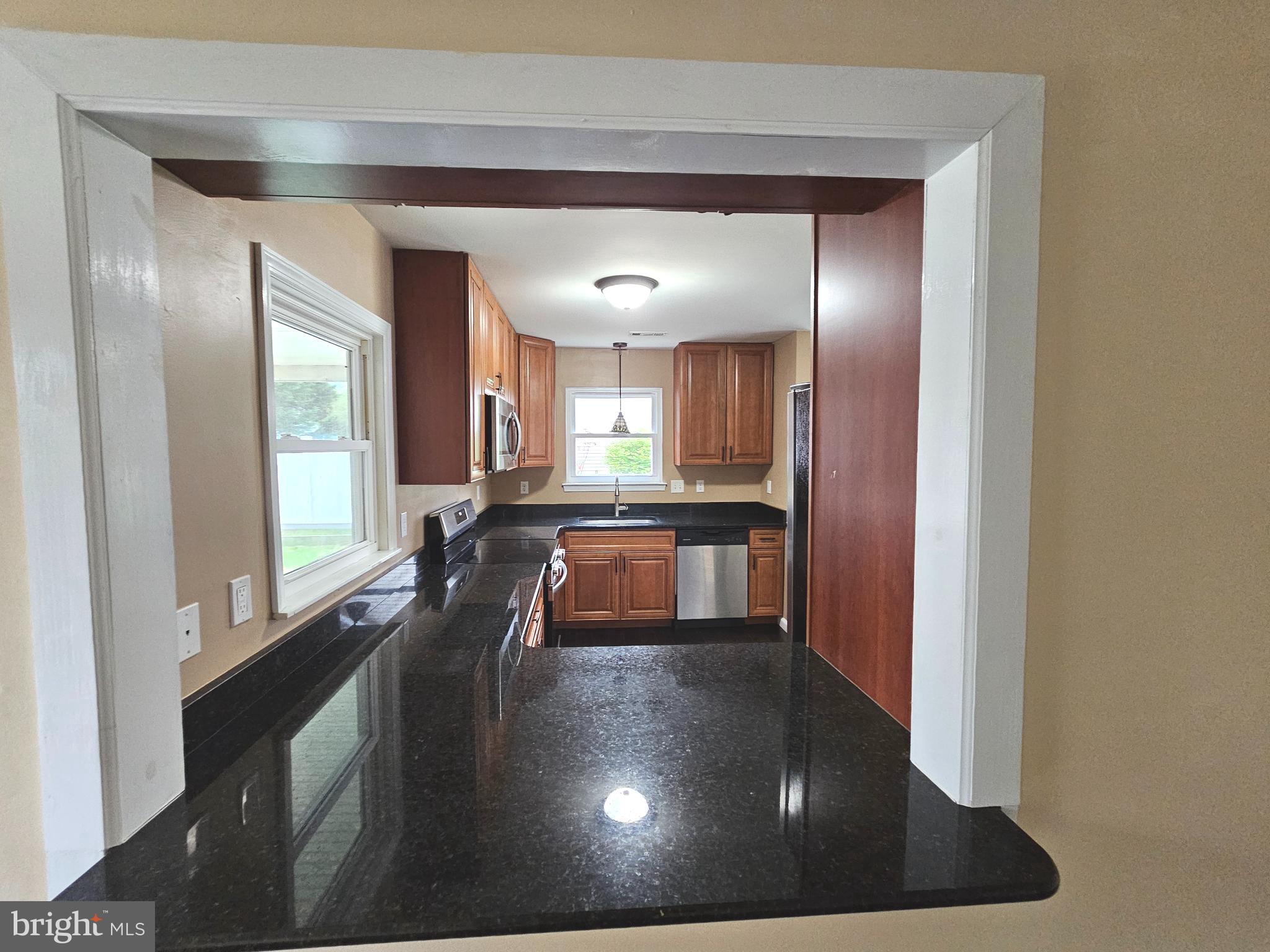 7 Gristmill Drive Dover, DE 19904 - Photo 10 of 26 a view of a living room and a kitchen