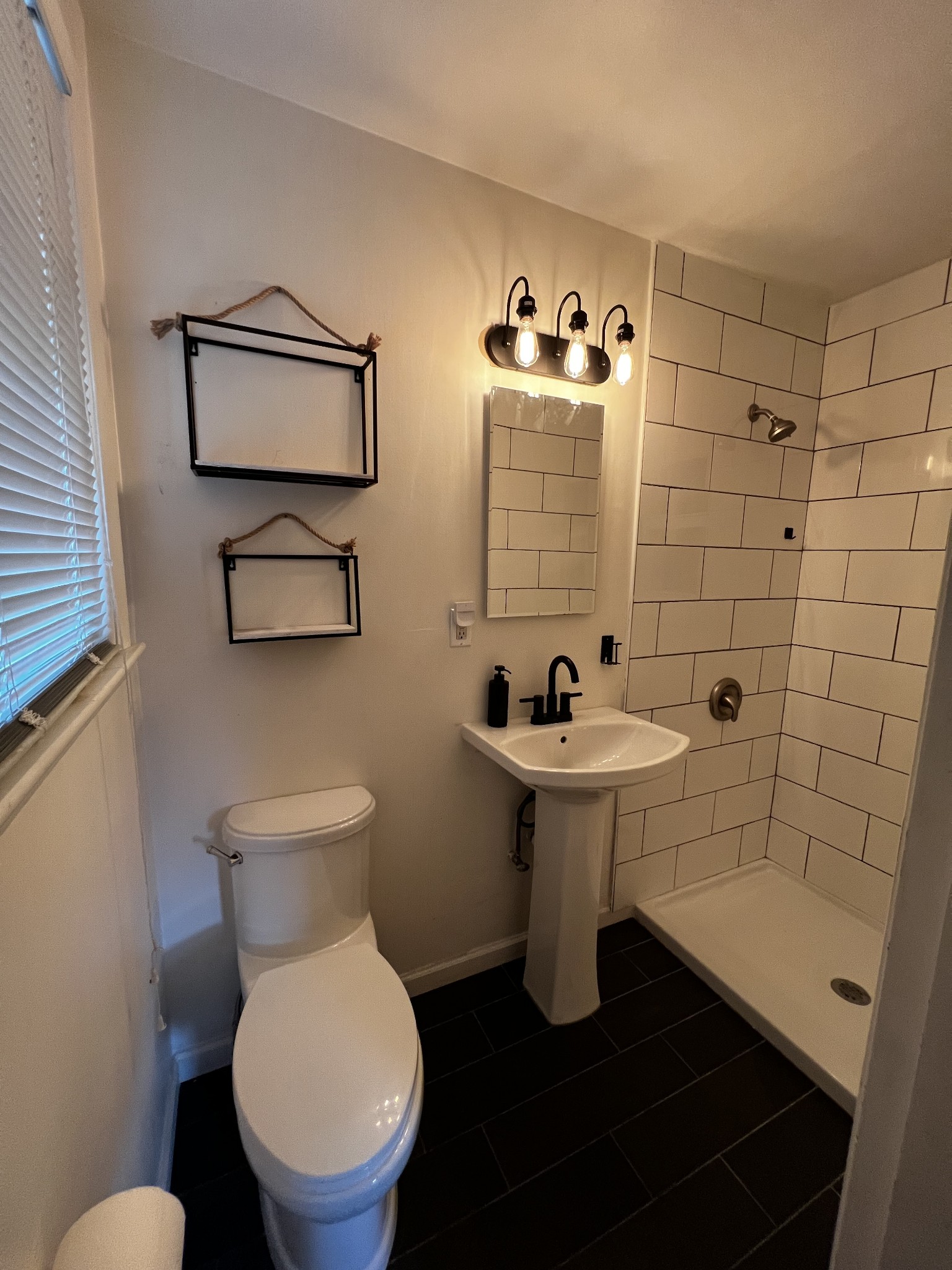 303 Gates Road Goodlettsville, TN 37072 - Photo 13 of 19 a bathroom with a sink a toilet and mirror