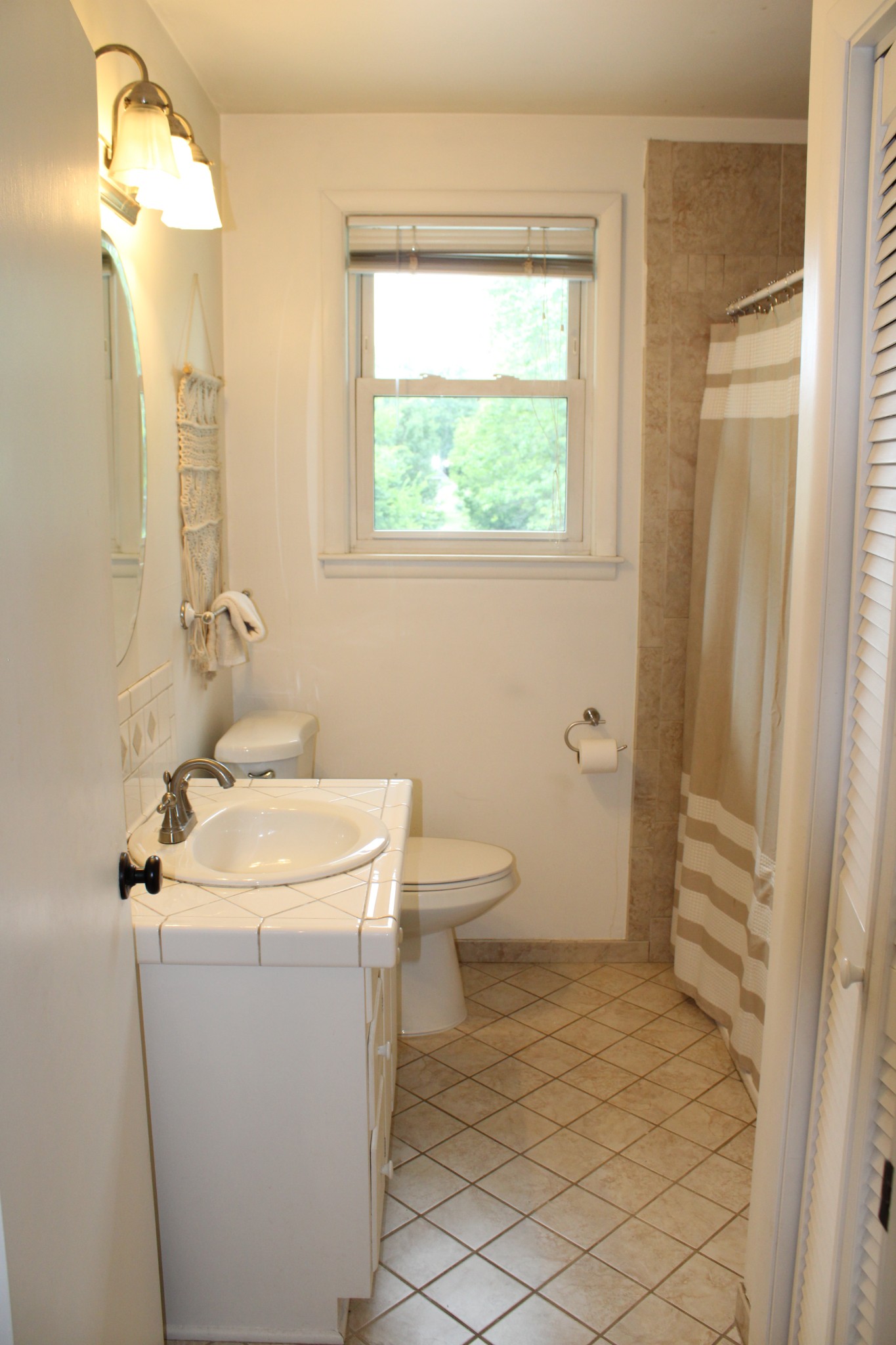303 Gates Road Goodlettsville, TN 37072 - Photo 18 of 19 a bathroom with a sink toilet and window