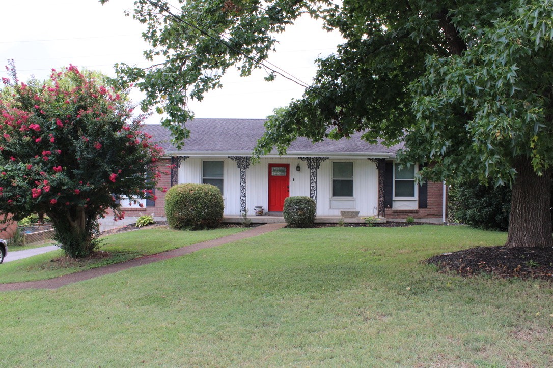 303 Gates Road Goodlettsville, TN 37072 - Photo 2 of 19 a front view of a house with a garden
