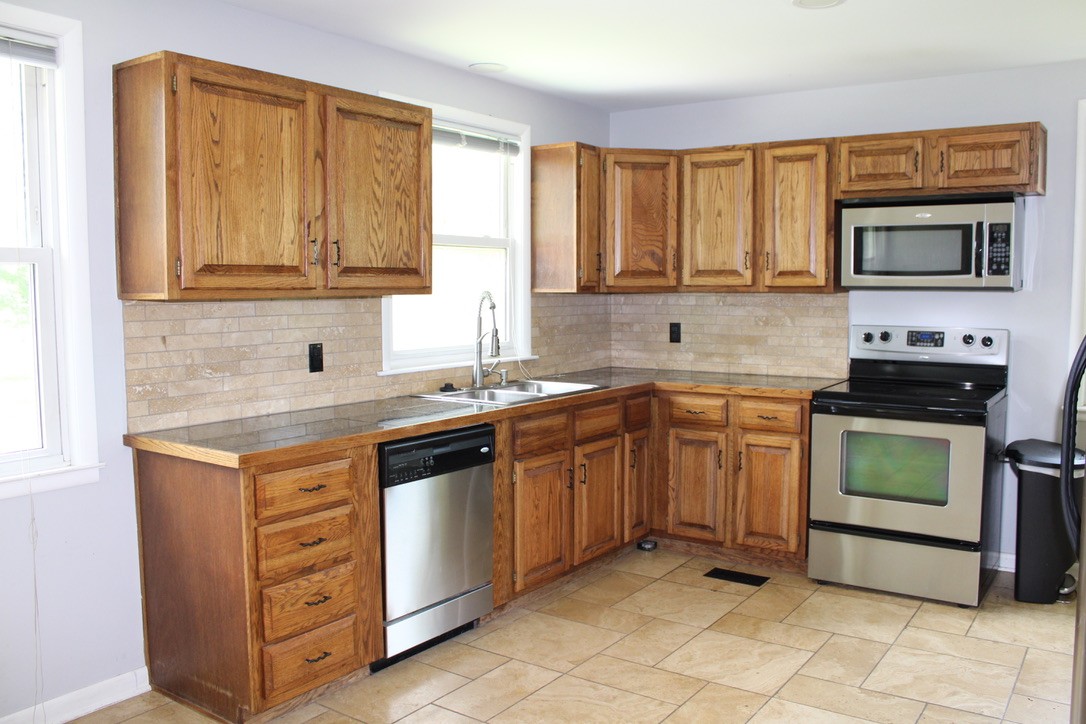303 Gates Road Goodlettsville, TN 37072 - Photo 9 of 19 a kitchen with stainless steel appliances granite countertop a sink stove and cabinets