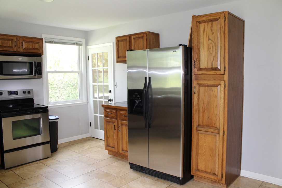 303 Gates Road Goodlettsville, TN 37072 - Photo 10 of 19 a kitchen with stainless steel appliances granite countertop a refrigerator and a stove top oven
