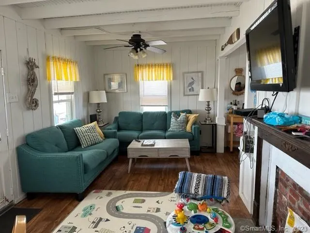 a living room with furniture and a window