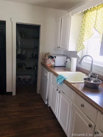 a kitchen with a sink and cabinets