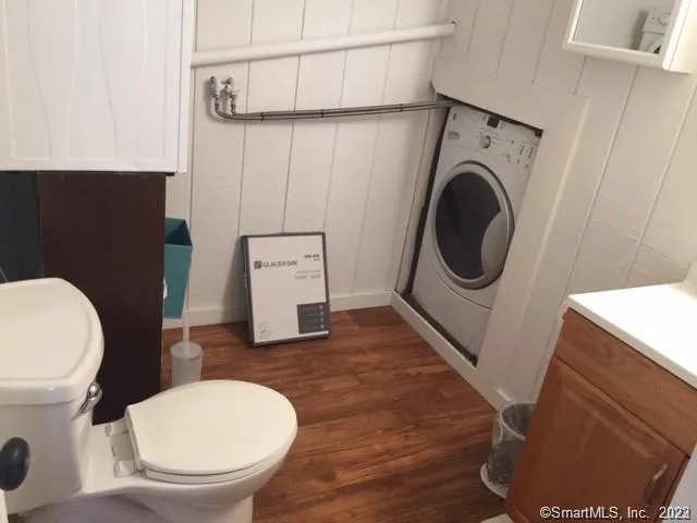 a bathroom with a toilet and a sink