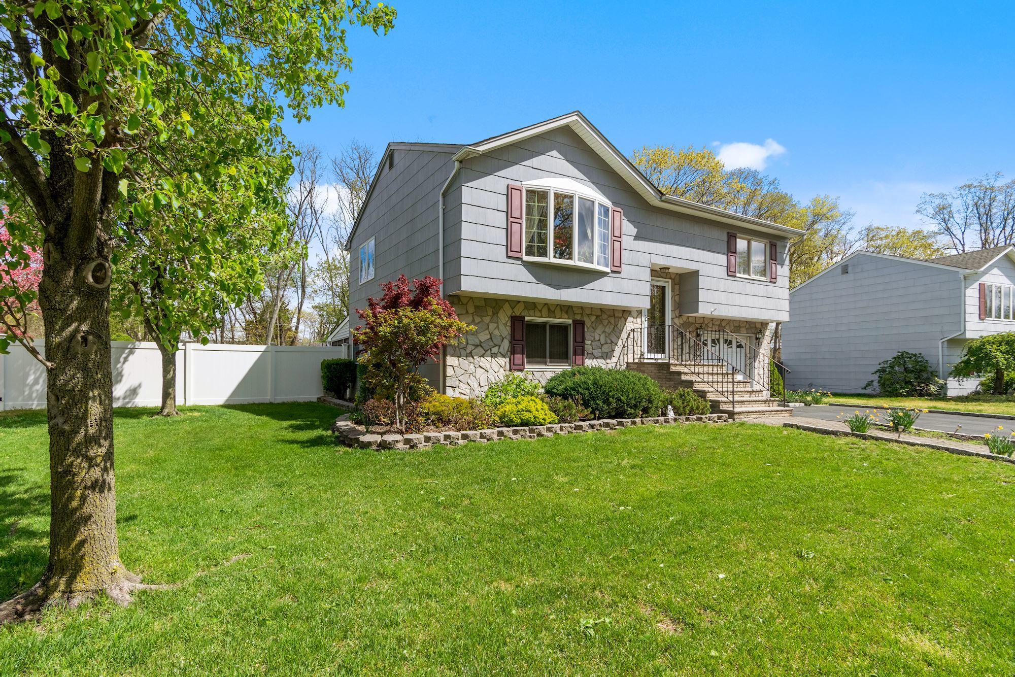 20 Bunkerhill Road Hazlet, NJ 07730 - Photo 2 of 27 a front view of a house with a yard