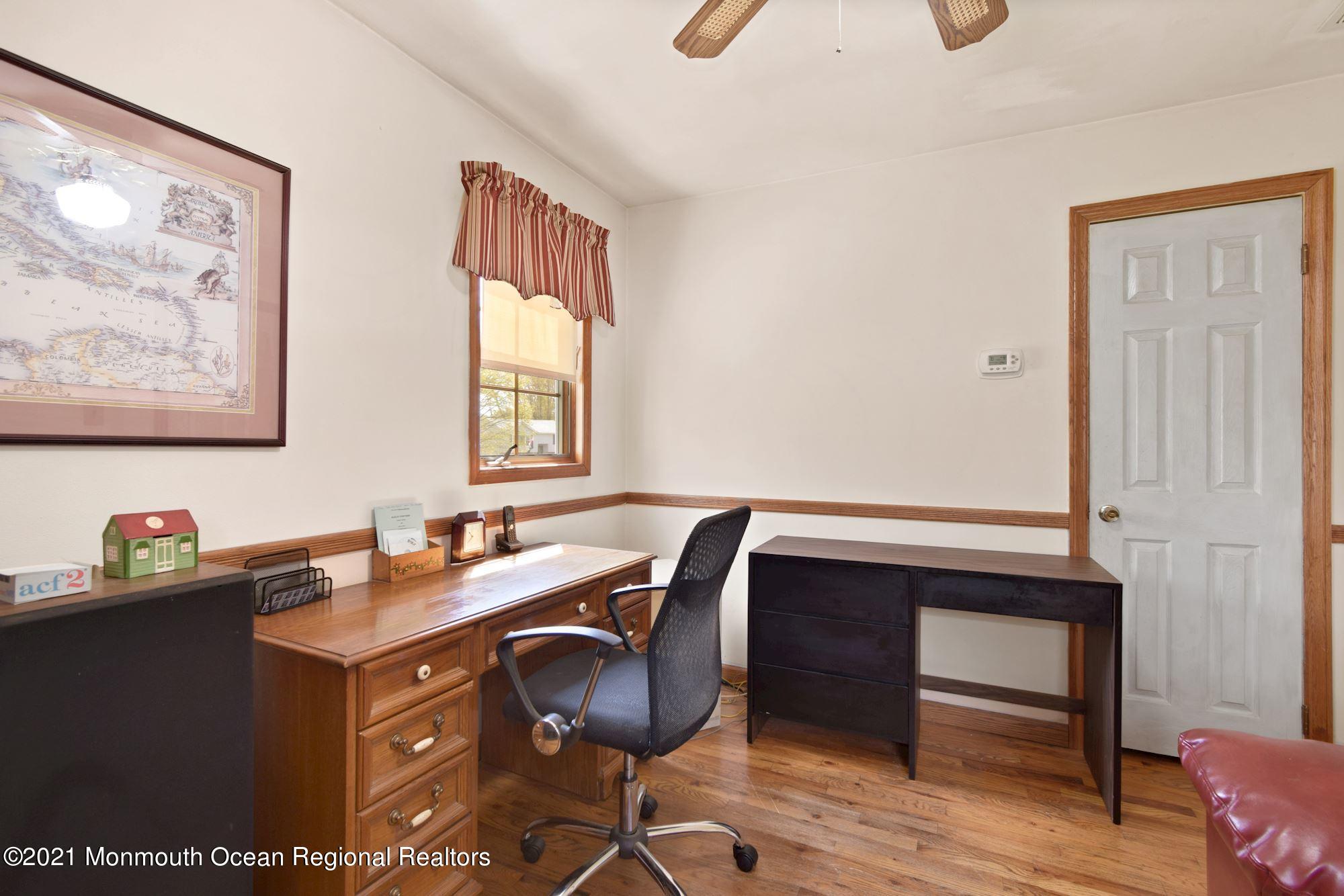 20 Bunkerhill Road Hazlet, NJ 07730 - Photo 11 of 27 a room with a table chairs and wooden floor