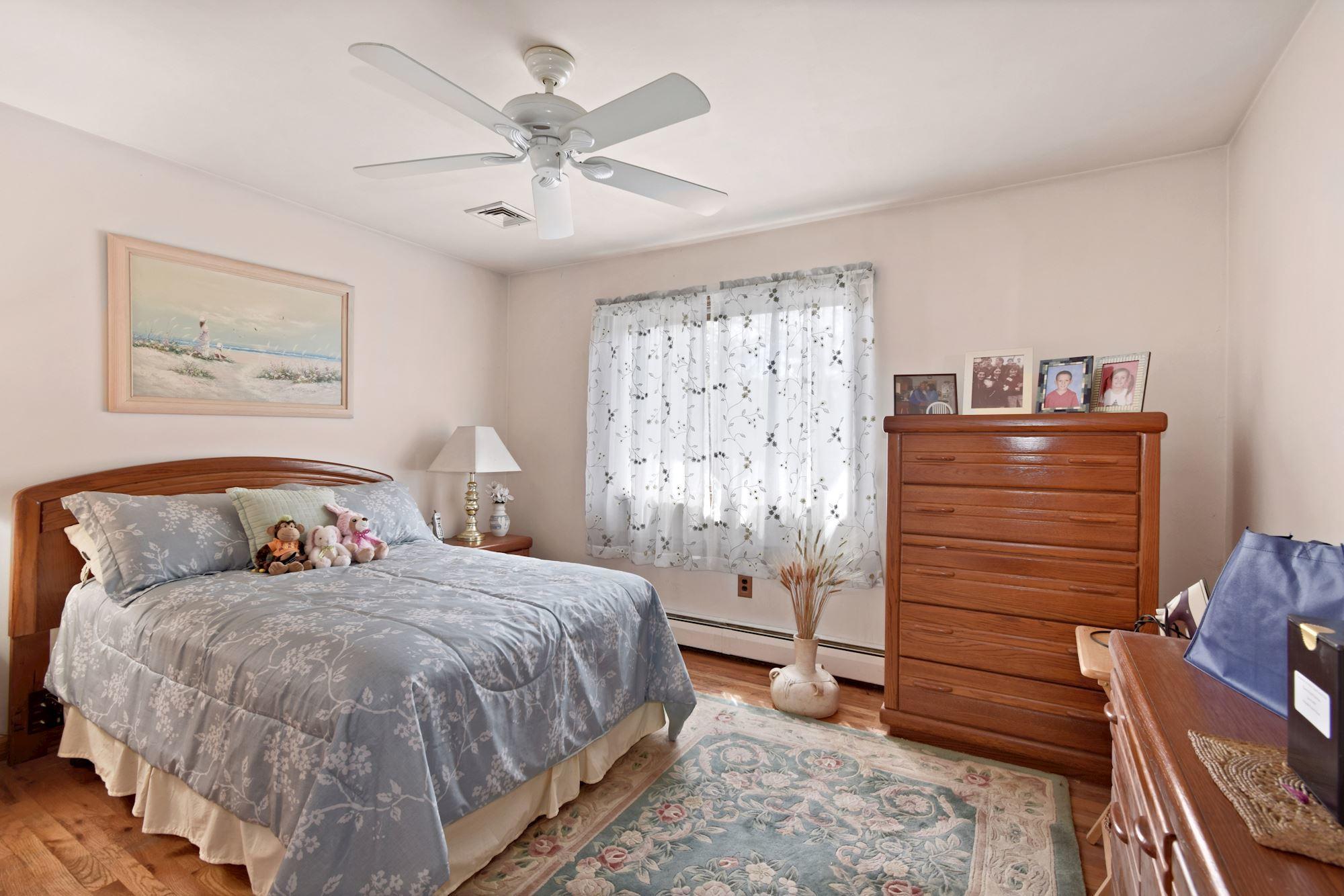 20 Bunkerhill Road Hazlet, NJ 07730 - Photo 12 of 27 a bedroom with a bed and a cabinets