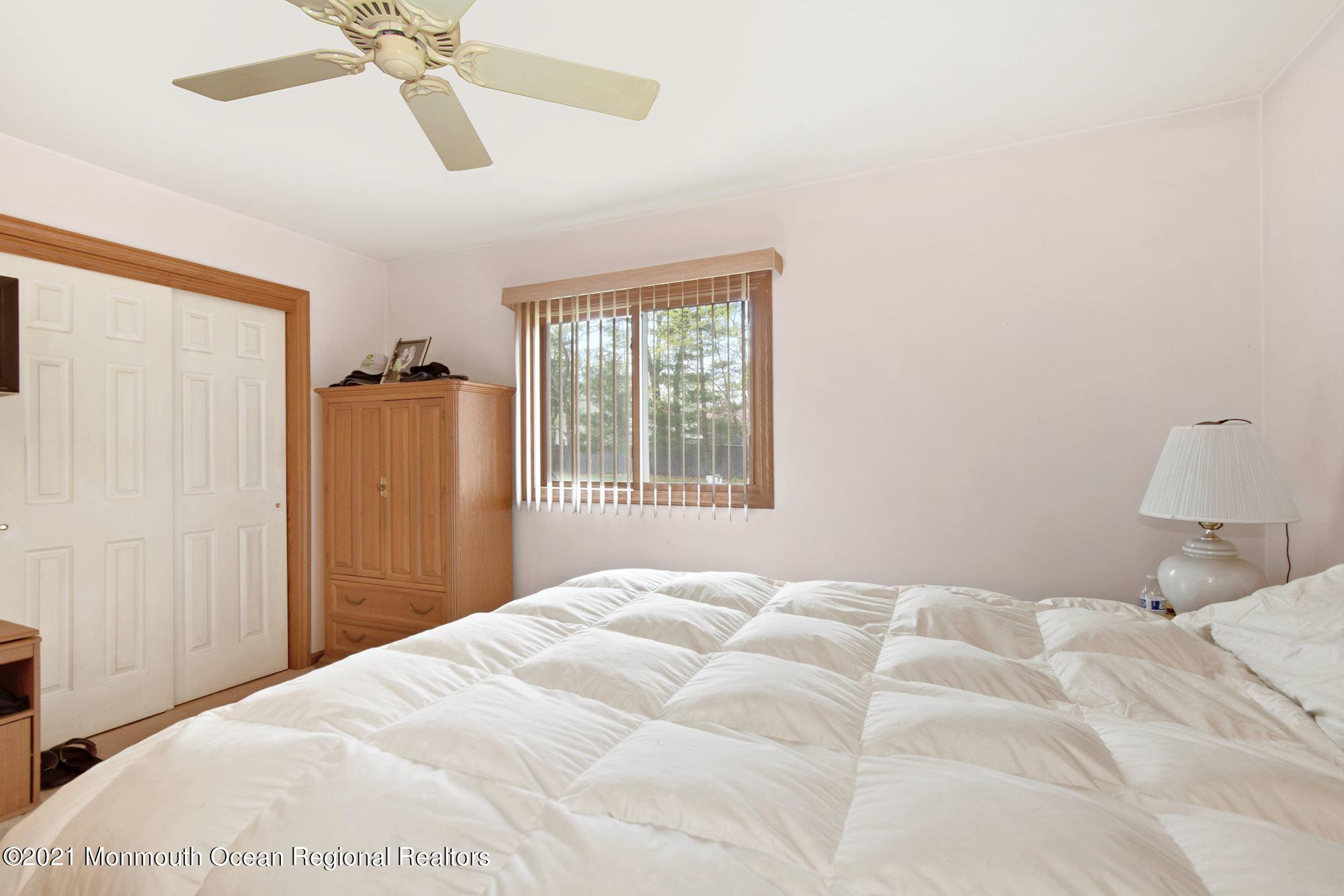 20 Bunkerhill Road Hazlet, NJ 07730 - Photo 15 of 27 a bedroom with a bed and a window