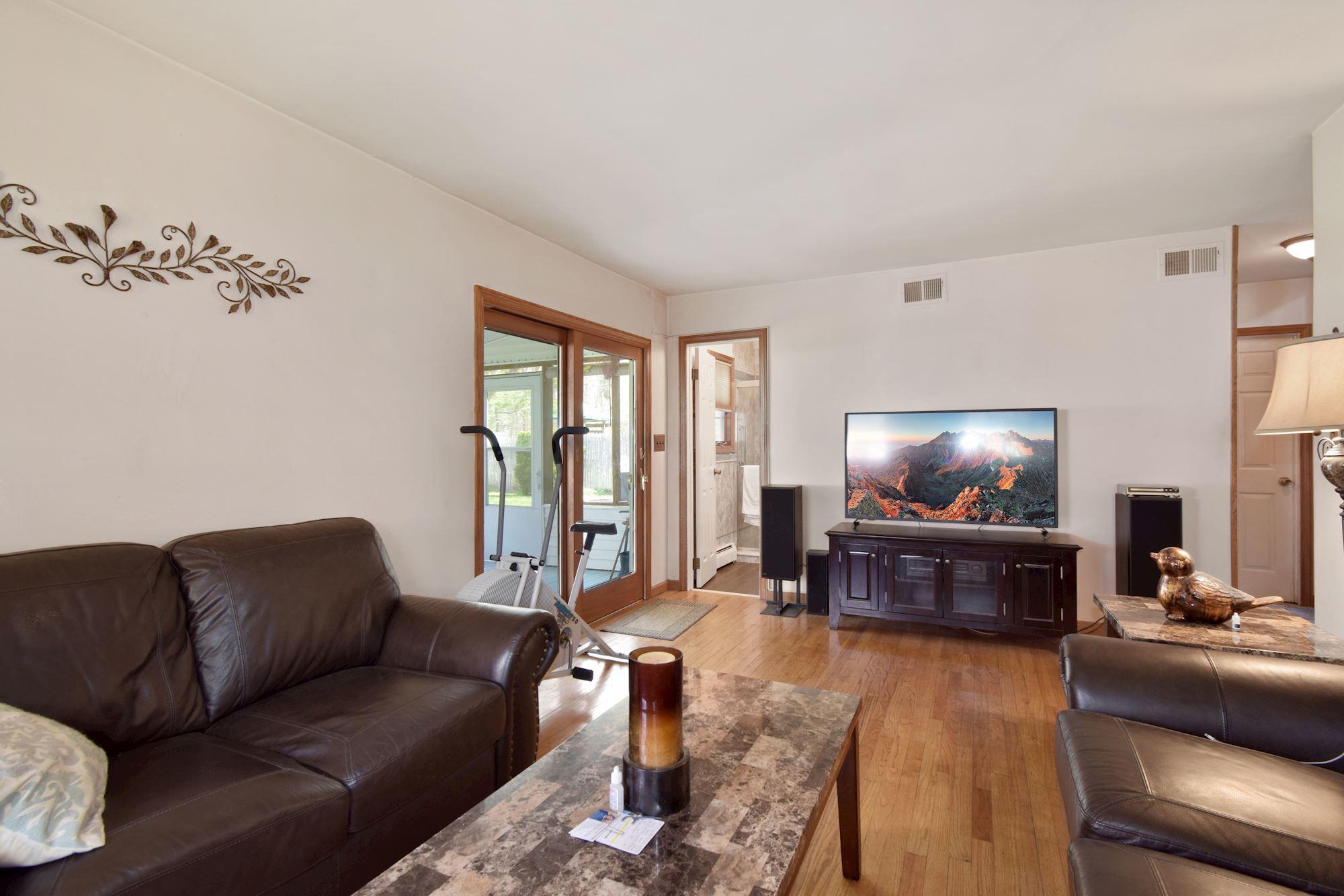 20 Bunkerhill Road Hazlet, NJ 07730 - Photo 17 of 27 a living room with furniture and a flat screen tv