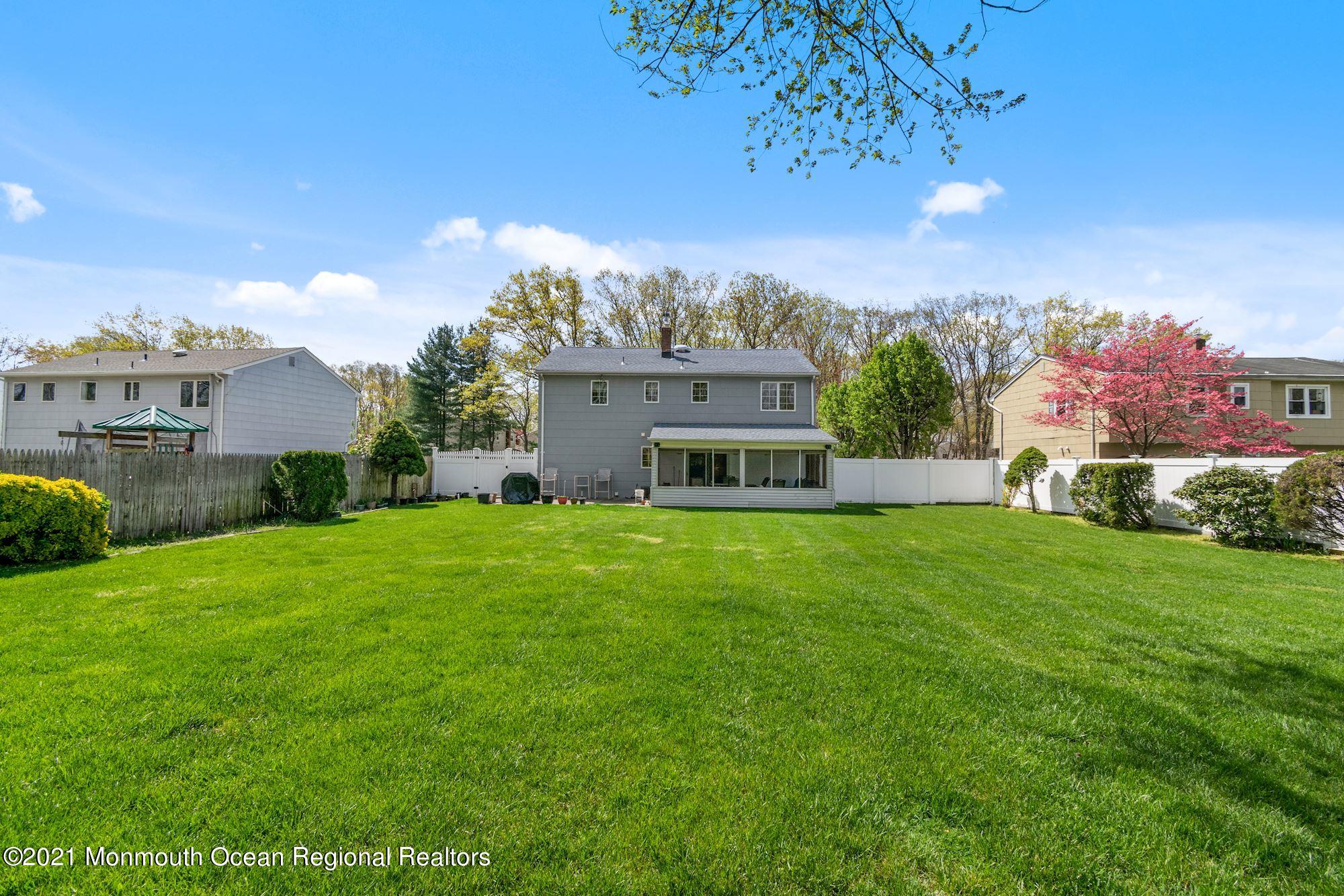 20 Bunkerhill Road Hazlet, NJ 07730 - Photo 23 of 27 a view of a house with a big yard and large trees