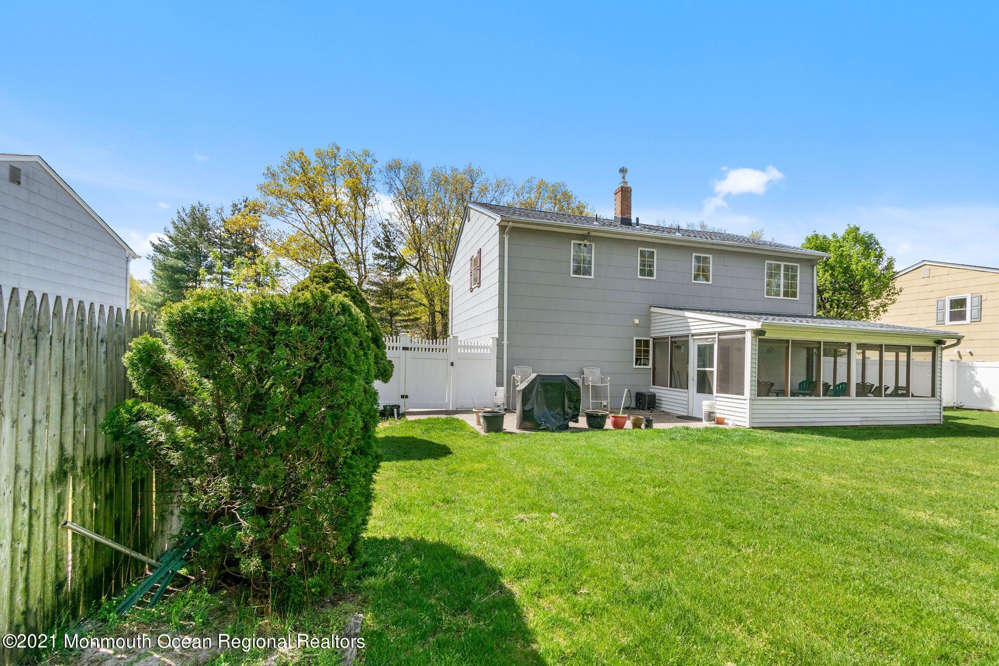 20 Bunkerhill Road Hazlet, NJ 07730 - Photo 24 of 27 a view of a house with a yard and sitting area