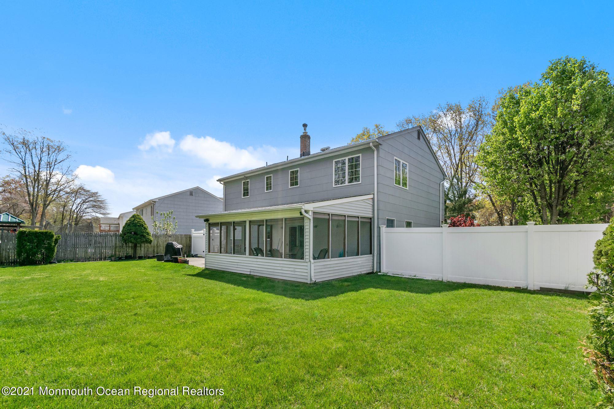 20 Bunkerhill Road Hazlet, NJ 07730 - Photo 25 of 27 a view of a house with a yard and sitting area