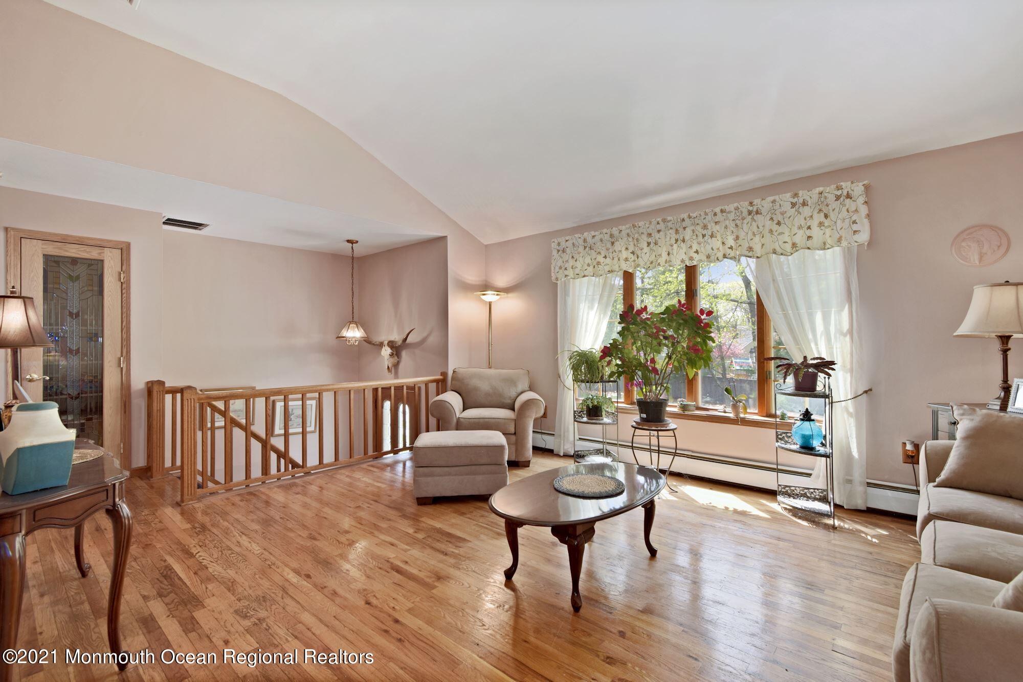20 Bunkerhill Road Hazlet, NJ 07730 - Photo 4 of 27 a living room with furniture and a large window
