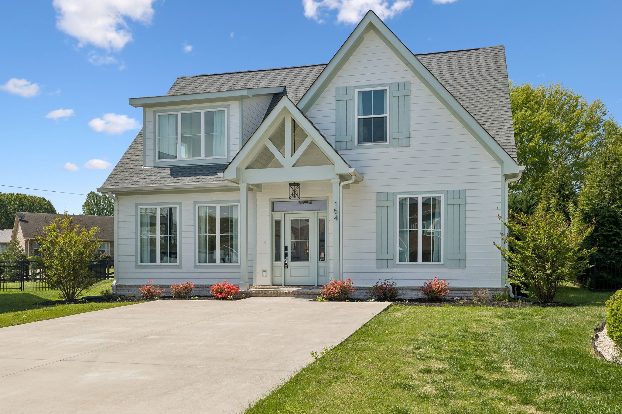 154 Barefoot Way Winchester, TN 37398 - Photo 2 of 98 a front view of a house with a garden and porch