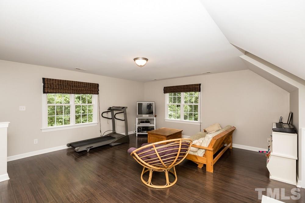 5016 Big Creek Road Raleigh, NC 27613 - Photo 21 of 25 a living room with furniture wooden floor and windows