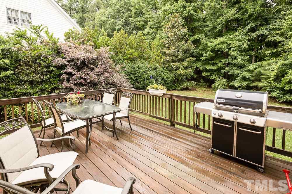 5016 Big Creek Road Raleigh, NC 27613 - Photo 22 of 25 a view of a chairs and table on the wooden floor
