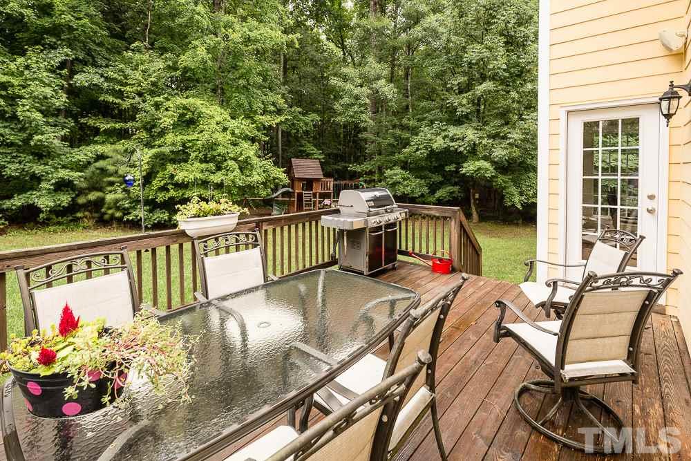 5016 Big Creek Road Raleigh, NC 27613 - Photo 23 of 25 a view of a chairs and table in patio