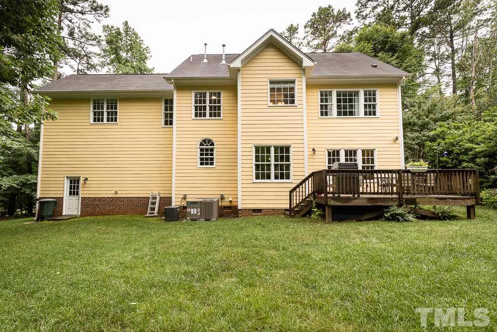 5016 Big Creek Road Raleigh, NC 27613 - Photo 24 of 25 a view of a house with a yard