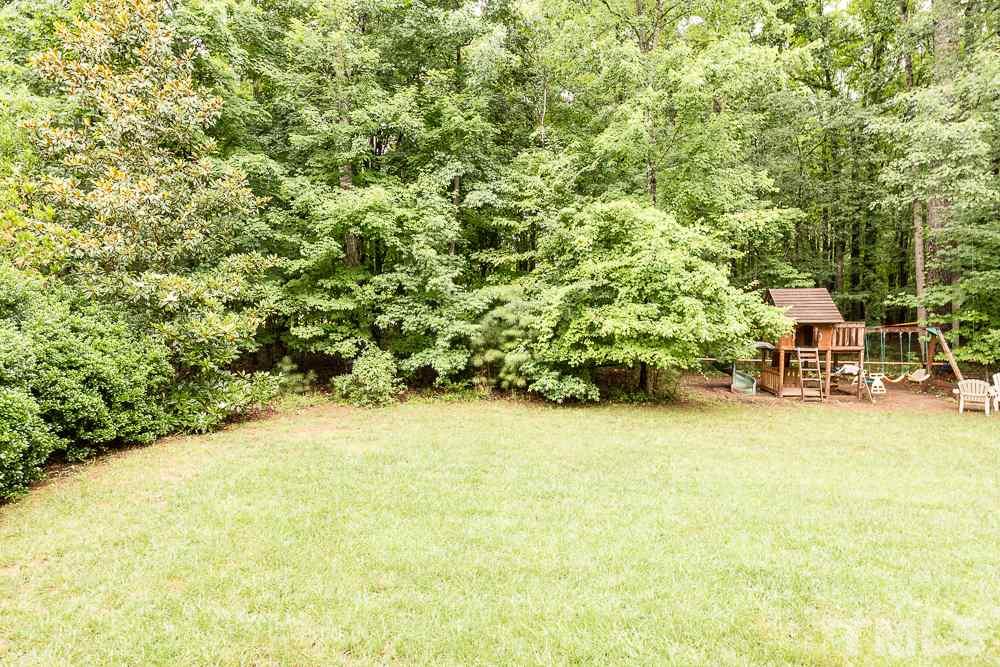 5016 Big Creek Road Raleigh, NC 27613 - Photo 25 of 25 a swimming pool with trees in front of it