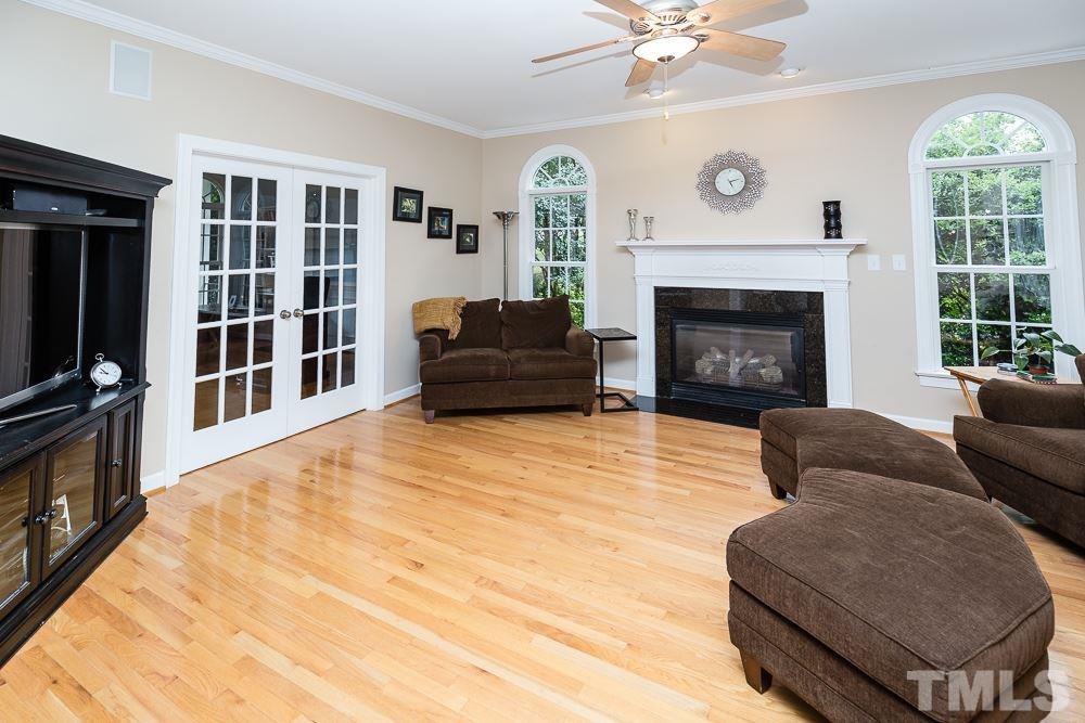 5016 Big Creek Road Raleigh, NC 27613 - Photo 8 of 25 a living room with furniture and a fireplace