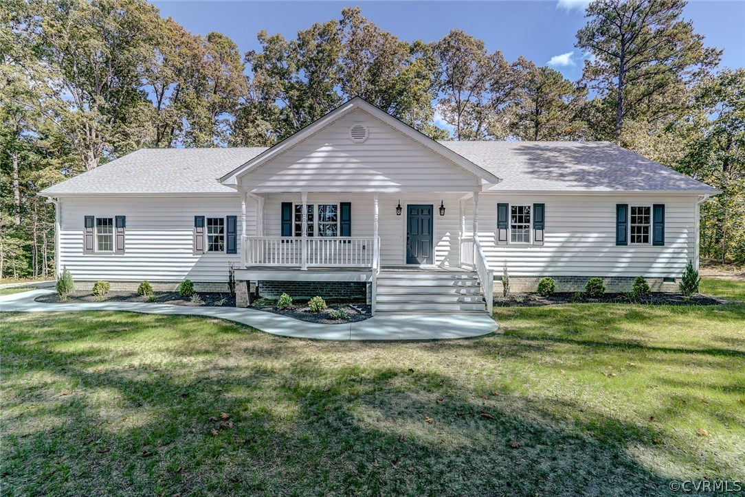 13521 Courthouse Road Dinwiddie, VA 23841 - Photo 1 of 35 a view of a house with a yard patio and fire pit