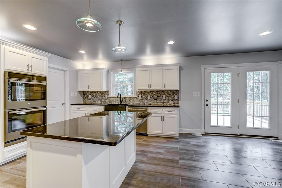 13521 Courthouse Road Dinwiddie, VA 23841 - Photo 13 of 35 a kitchen with granite countertop a stove and a sink