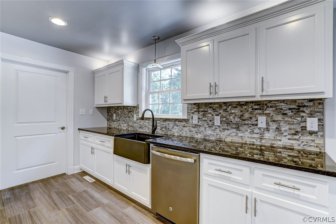 13521 Courthouse Road Dinwiddie, VA 23841 - Photo 14 of 35 a kitchen with stainless steel appliances granite countertop a sink and cabinets