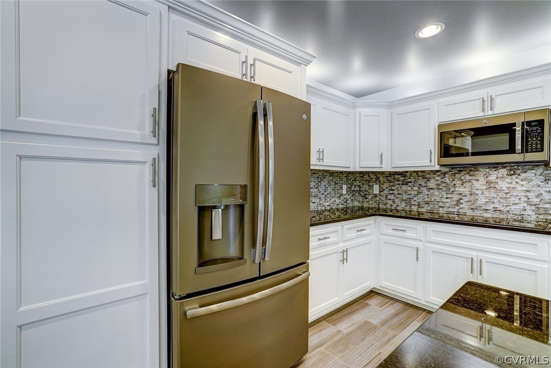 13521 Courthouse Road Dinwiddie, VA 23841 - Photo 20 of 35 a kitchen with stainless steel appliances granite countertop a refrigerator and a microwave